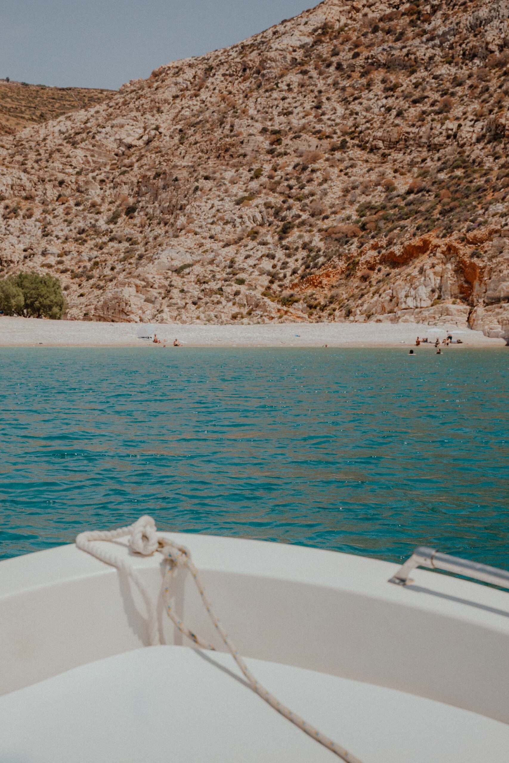 Paralia Livadaki Folegandros viewed from boat showing remote beach, clear waters and rugged coastline