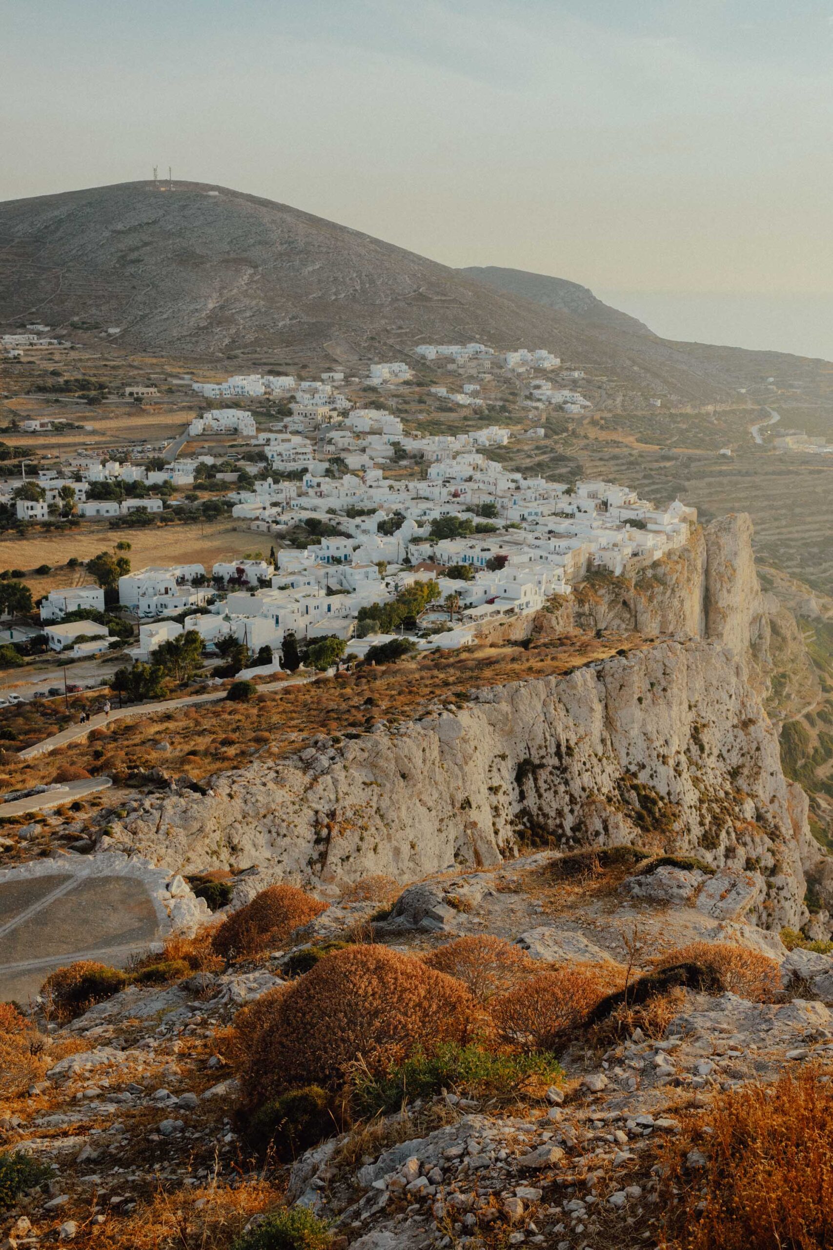 Panoramic view of Chora Folegandros from Church of Panagia revealing whitewashed buildings, narrow streets and Aegean Sea backdrop