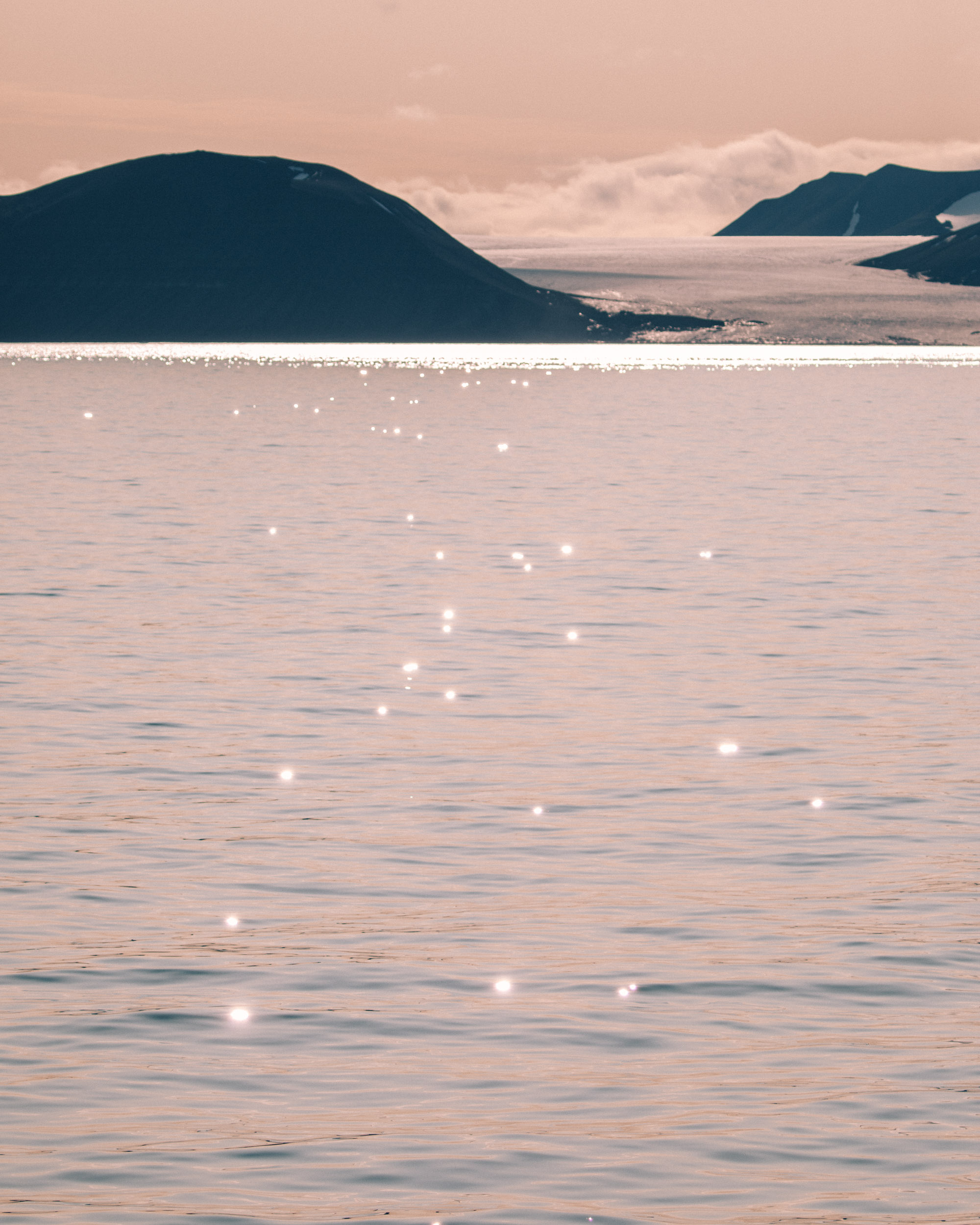 Pink sunset and glacier in Svalbard